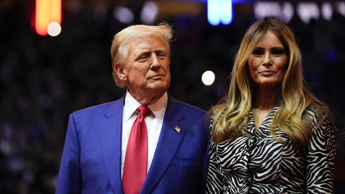 Republican presidential nominee former President Donald Trump and former first lady Melania Trump stand on stage a campaign rally at Madison Square Garden, Sunday, Oct. 27, 2024, in New York. (AP Photo/Evan Vucci)