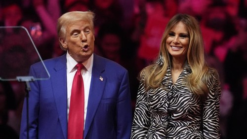 Republican presidential nominee former President Donald Trump and former first lady Melania Trump stand on stage a campaign rally at Madison Square Garden, Sunday, Oct. 27, 2024, in New York. (AP Photo/Evan Vucci)