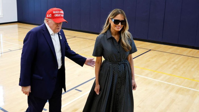 PALM BEACH, FLORIDA - NOVEMBER 05: Republican presidential nominee former President Donald Trump and his wife Melania Trump talk to reporters after casting their votes at the polling place in the Morton and Barbara Mandel Recreation Center on Election Day, on November 05, 2024 in Palm Beach, Florida.  Trump will hold an Election Night event at the Palm Beach Convention Center. (Photo by Chip Somodevilla/Getty Images)