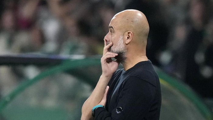 Manchester Citys head coach Pep Guardiola watches from the touchline during the Champions League opening phase soccer match between Sporting CP and Manchester City at the Alvalade stadium in Lisbon, Tuesday, Nov. 5, 2024. (AP Photo/Armando Franca)