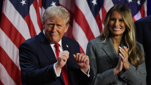 Republican presidential nominee and former U.S. President Donald Trump dances accompanied by Melania Trump, after speaking following early results from the 2024 U.S. presidential election in Palm Beach County Convention Center, in West Palm Beach, Florida, U.S., November 6, 2024. REUTERS/Carlos Barria