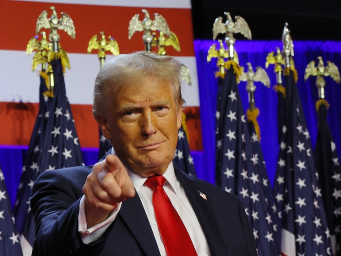 Republican presidential nominee and former U.S. President Donald Trump takes the stage to address supporters at his rally, at the Palm Beach County Convention Center in West Palm Beach, Florida, U.S., November 6, 2024. REUTERS/Brian Snyder