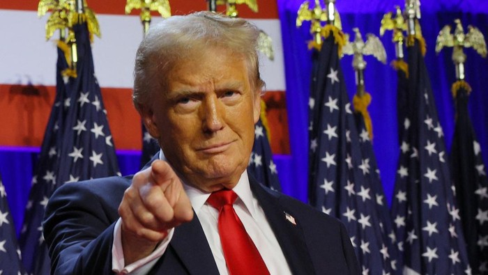 Republican presidential nominee and former U.S. President Donald Trump takes the stage to address supporters at his rally, at the Palm Beach County Convention Center in West Palm Beach, Florida, U.S., November 6, 2024. REUTERS/Brian Snyder