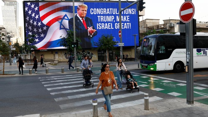 Republican presidential nominee and former U.S. President Donald Trump appears on a congratulatory billboard for the 2024 U.S Presidential Election, in Tel Aviv, Israel, November 6, 2024. REUTERS/Thomas Peter
