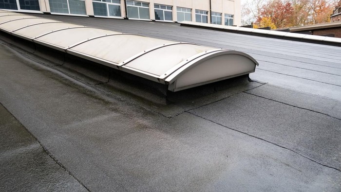 Plastic dome on a flat roof on a large building in the heart of the city