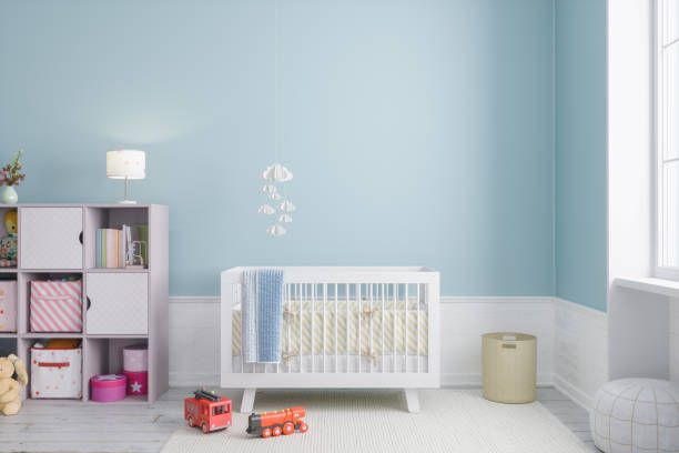 Ilustrasi ruangan kamar anak dengan nuansa warna biru muda dan putih.