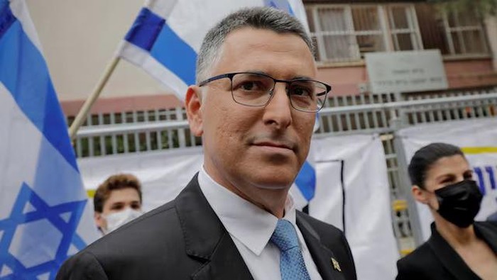 Leader of the New Hope party Gideon Saar and his wife Geula walk outside a polling station during a general election in Tel Aviv, Israel March 23, 2021. Jalaa Marey/Pool via REUTERS/File Photo Purchase Licensing Rights