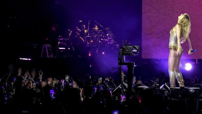Fans react during the opening of Taylor Swift's performance during the opening show of the Toronto dates for The Eras Tour, on Thursday, November 14, 2024. (Chris Young/The Canadian Press via AP)