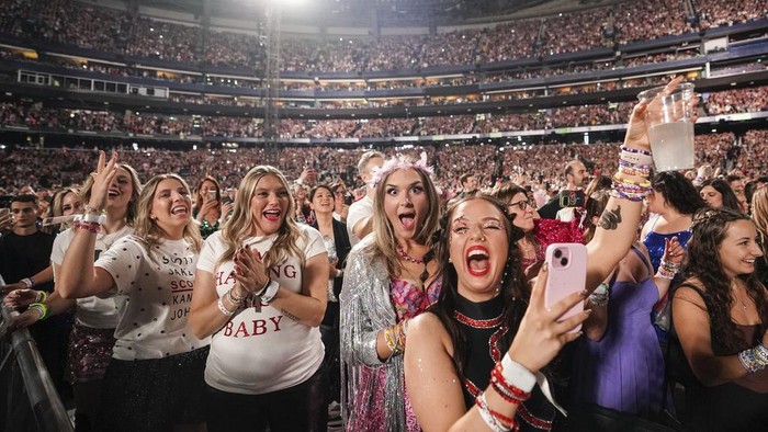 Fans react during the opening of Taylor Swift's performance during the opening show of the Toronto dates for The Eras Tour, on Thursday, November 14, 2024. (Chris Young/The Canadian Press via AP)