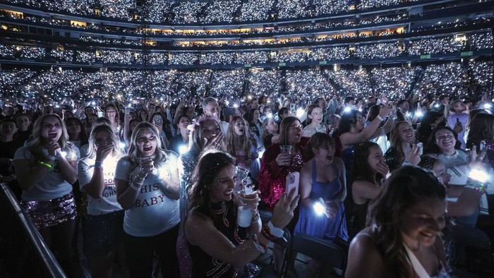 Fans react during the opening of Taylor Swift's performance during the opening show of the Toronto dates for The Eras Tour, on Thursday, November 14, 2024. (Chris Young/The Canadian Press via AP)