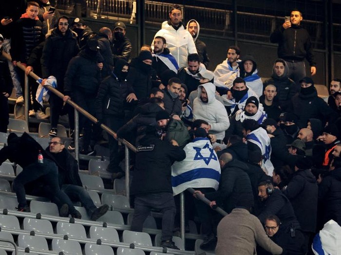 PARIS, FRANCE - NOVEMBER 14: Fans of Team Israel fight during the UEFA Nations League 2024/25 League A Group A2 match between France and Israel at Stade de France on November 14, 2024 in Paris, France. (Photo by Xavier Laine/Getty Images)