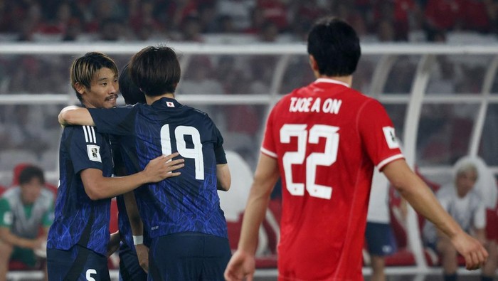 Soccer Football - World Cup - Asian Qualifiers - Third Round - Group C - Indonesia v Japan - Gelora Bung Karno Main Stadium, Jakarta, Indonesia - November 15, 2024  Japans Hidemasa Morita celebrates scoring their third goal with teammates REUTERS/Ajeng Dinar Ulfiana