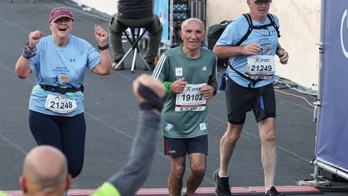 Ploutarchos Pourliakas, 88, the oldest runner in the 41st Athens Authentic Marathon crosses the finish line at the Panathenaic Stadium in Athens, Greece, November 10, 2024. REUTERS/Louisa Gouliamaki