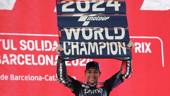 Moto GP World Champion winner Spains rider Jorge Martin of the Prima Pramac Racing celebrates on the podium after finishing third during the MotoGP race of the Grand Prix of Barcelona at the Catalunya racetrack in Montmelo, just outside of Barcelona, Spain, Sunday, Nov. 17, 2024. (AP Photo/Joan Monfort)