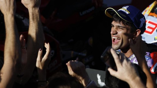 Moto GP World Champion winner Spains rider Jorge Martin of the Prima Pramac Racing celebrates with team members after finishing third during the MotoGP race of the Grand Prix of Barcelona at the Catalunya racetrack in Montmelo, just outside of Barcelona, Spain, Sunday, Nov. 17, 2024. (AP Photo/Joan Monfort)