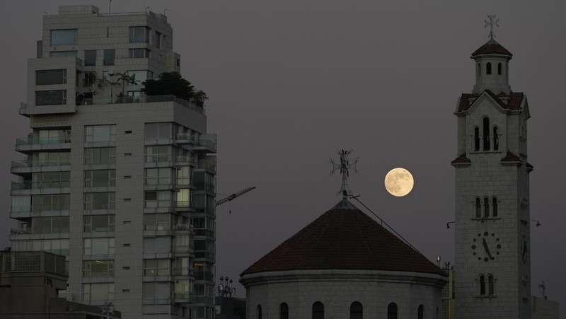 The supermoon rises over the Armenian-Catholic Cathedral in Beirut, Lebanon, Friday, Nov. 15, 2024. (AP Photo/Bilal Hussein)