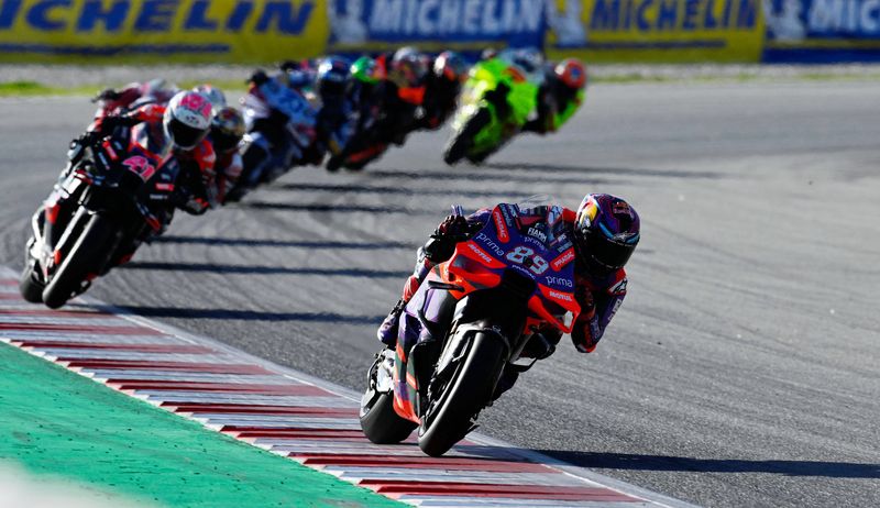 MotoGP - Solidarity Grand Prix of Barcelona - Circuit de Barcelona-Catalunya, Barcelona, Spain - November 17, 2024 Prima Pramac Racing's Jorge Martin celebrates on the podium with teammates after winning the MotoGP World Championship REUTERS/Pablo Morano