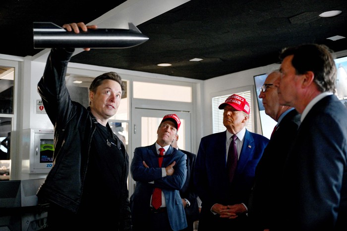 U.S. President-elect Donald Trump walks with Elon Musk before attending a viewing of the launch of the sixth test flight of the SpaceX Starship rocket, in Brownsville, Texas, U.S., November 19, 2024 . Brandon Bell/Pool via REUTERS     TPX IMAGES OF THE DAY