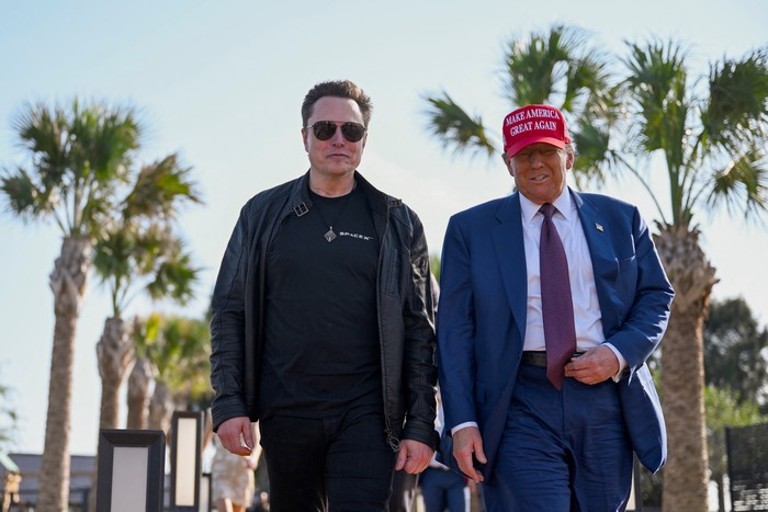 U.S. President-elect Donald Trump walks with Elon Musk before attending a viewing of the launch of the sixth test flight of the SpaceX Starship rocket, in Brownsville, Texas, U.S., November 19, 2024 . Brandon Bell/Pool via REUTERS     TPX IMAGES OF THE DAY