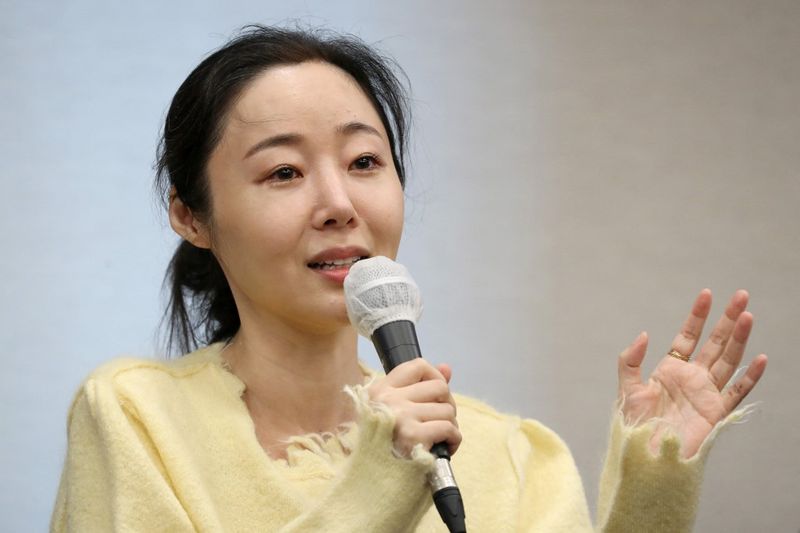 Min Hee-jin, CEO of ADOR, a subsidiary label of K-pop powerhouse HYBE, reacts during a press conference following her company's shareholder meeting in Seoul on May 31, 2024. (Photo by Han Myung-Gu / POOL / AFP)