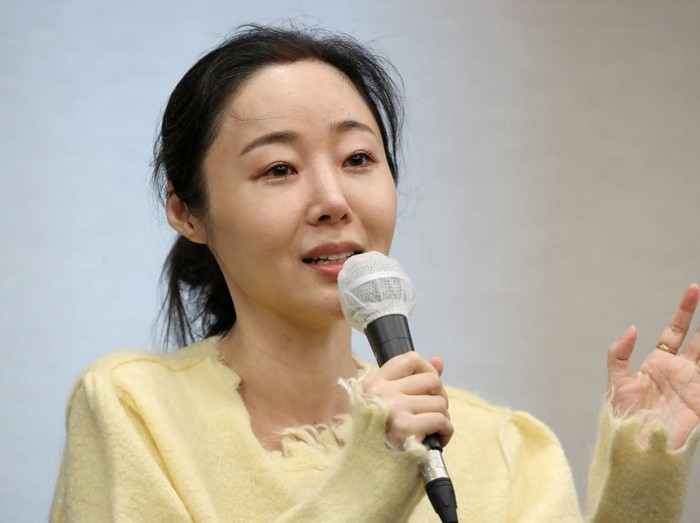 SKOREA-MUSIC-KPOP-HYBE Min Hee-jin, CEO of ADOR, a subsidiary label of K-pop powerhouse HYBE, reacts during a press conference following her companys shareholder meeting in Seoul on May 31, 2024. (Photo by Han Myung-Gu / POOL / AFP)