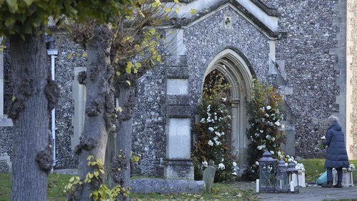 A florist arranges flowers ahead of the funeral service for One Direction singer Liam Payne at a church in the Home Counties, England, Wednesday Nov. 20, 2024. (Andrew Matthews/PA via AP)