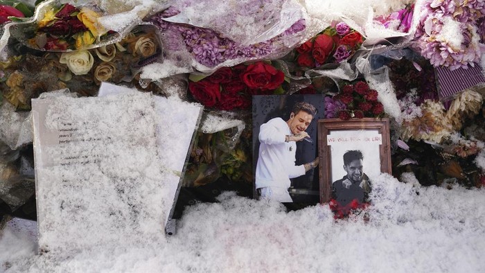 Floral tributes to singer Liam Payne at a memorial in West Park in his hometown of Wolverhampton, England, Wednesday, Nov. 20, 2024. (Jacob King/PA via AP)