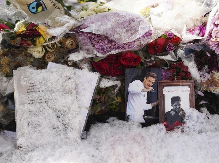 Floral tributes to singer Liam Payne at a memorial in West Park in his hometown of Wolverhampton, England, Wednesday, Nov. 20, 2024. (Jacob King/PA via AP)