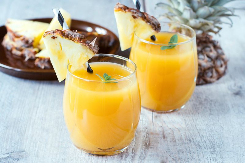 Fresh pineapple juice in the glasse,selective focus