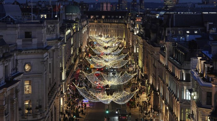 Christmas lights are displayed on Regent Street, in London, Wednesday, Nov. 20, 2024. (AP Photo/Kin Cheung)