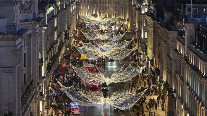 Christmas lights are displayed on Regent Street, in London, Wednesday, Nov. 20, 2024. (AP Photo/Kin Cheung)