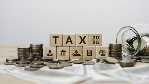 Tax planning 2025 concept with icons on wooden blocks Tax reduction, Individual income return to Government. paperwork, financial research, report. Calculation tax return