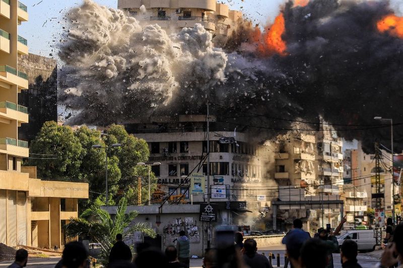 Fire and smoke erupt from a building just after an Israeli airstrike in Beirut's southern Shayah neighbourhood on November 22, 2024, amid the ongoing war between Israel and Hezbollah. (Photo by AFP)