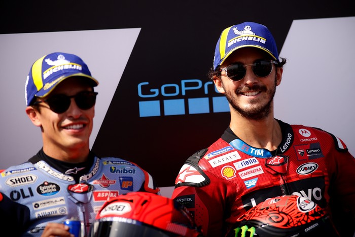 ALCANIZ, SPAIN - AUGUST 31: Francesco Bagnaia from Italy of Ducati Lenovo Team and Marc Marquez from Spain of Gresini Racing MotoGP smiling during MotoGP of Aragon Qualifying at Motorland Aragon Circuit on August 31, 2024 in Alcaniz, Spain. (Photo by Joan Cros - Corbis/Getty Images)
