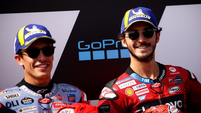 ALCANIZ, SPAIN - AUGUST 31: Francesco Bagnaia from Italy of Ducati Lenovo Team and Marc Marquez from Spain of Gresini Racing MotoGP smiling during MotoGP of Aragon Qualifying at Motorland Aragon Circuit on August 31, 2024 in Alcaniz, Spain. (Photo by Joan Cros - Corbis/Getty Images)