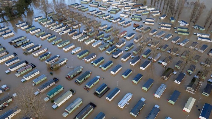 A drone view shows static caravans surrounded by floodwater after the River Nene burst its banks at Billing Aquadrome near Northampton, Britain, November 25, 2024. REUTERS/Phil Noble