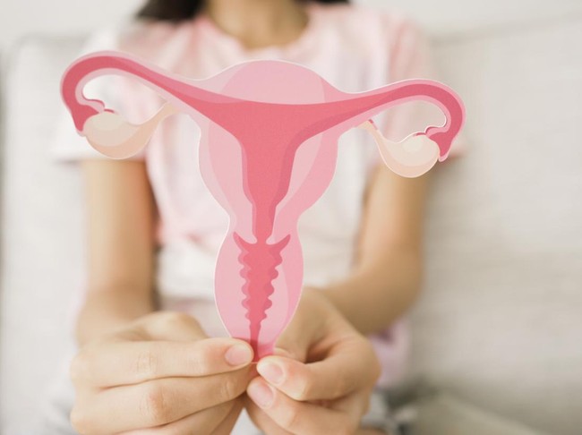 Preteen girl hands holding uterus, teen health, PCOS, first period concept