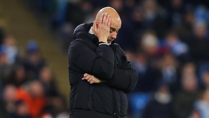 MANCHESTER, ENGLAND - NOVEMBER 26: Josep Pep Guardiola, manager of Manchester City, looks dejected during the UEFA Champions League 2024/25 League Phase MD5 match between 	Manchester City and Feyenoord at City of Manchester Stadium on November 26, 2024 in Manchester, England. (Photo by James Gill - Danehouse/Getty Images)