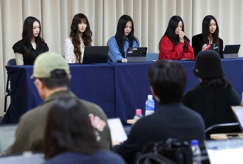 South Korean K-pop girl group NewJeans members (L-R) Haerin, Danielle, Minji, Hanni and Hyein attend a press conference in Seoul on November 28, 2024. Chart-topping K-pop group NewJeans quit their label ADOR, citing the group faced 