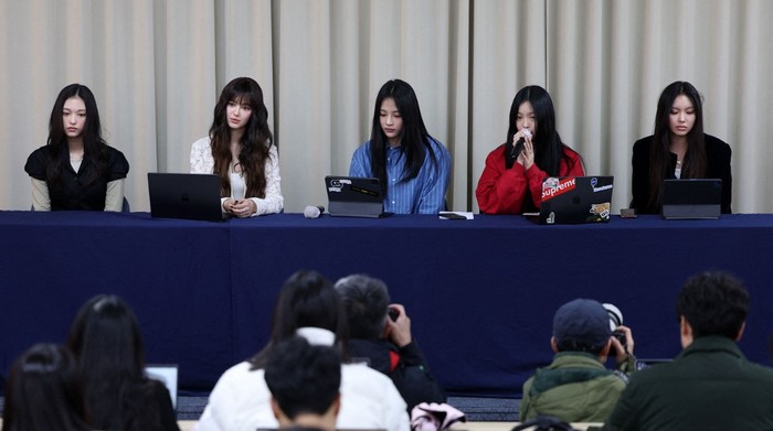 NewJeans South Korean K-pop girl group NewJeans members (L-R) Haerin, Danielle, Minji, Hanni and Hyein attend a press conference in Seoul on November 28, 2024. Chart-topping K-pop group NewJeans quit their label ADOR, citing the group faced mistreatment due to the company. (Photo by YONHAP / AFP) / - South Korea OUT / NO ARCHIVES - RESTRICTED TO SUBSCRIPTION USE