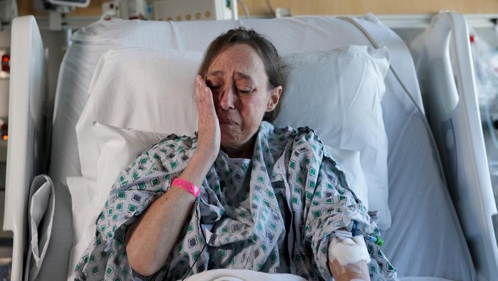 Cheryl Mehrkar, who received the world's first fully robotic double lung transplant, reacts during an interview with Reuters as she recovers in her room at the NYU Langone Health Center Transplant Institute in New York City, U.S., November 19, 2024. REUTERS/Kent Edwards