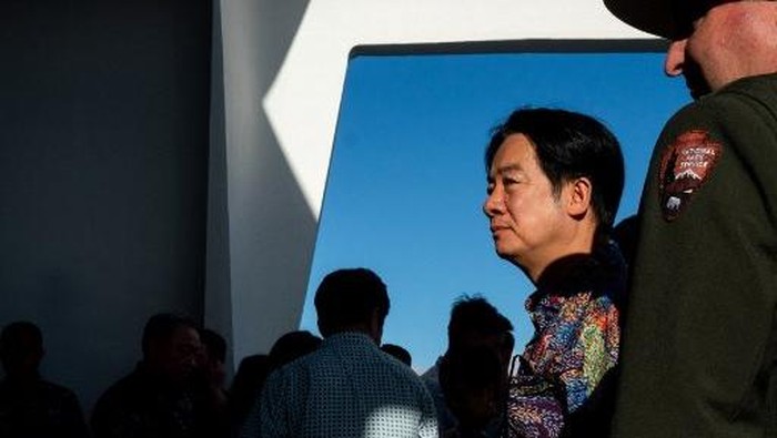 Taiwan President Lai Ching-te (2nd R) visits the USS Arizona Memorial at Pearl Harbor in Honolulu, Hawaii on November 30, 2024. Taiwan President Lai Ching-te arrived November 30 in the United States for the start of a week-long tour in the Pacific that he said would usher in a new era of democracy, but has sparked fury in Beijing. (Photo by Akio Wang / AFP)