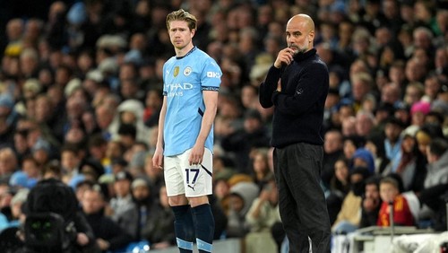 Manchester City substitute Kevin De Bruyne alongside manager Pep Guardiola during the Premier League match at the Etihad Stadium, Manchester. Picture date: Saturday November 23, 2024. (Photo by Martin Rickett/PA Images via Getty Images)