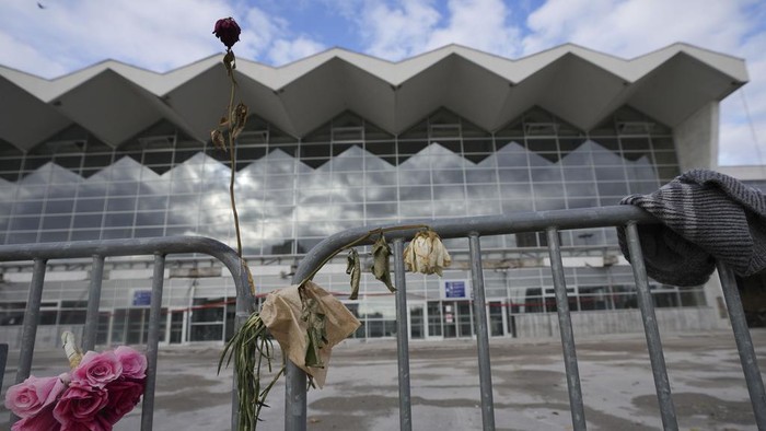 People march during a protest following the collapse of a concrete canopy at the railway station that killed 15 people one month ago, in Novi Sad, Serbia, Sunday, Dec. 1, 2024. (AP Photo/Darko Vojinovic)