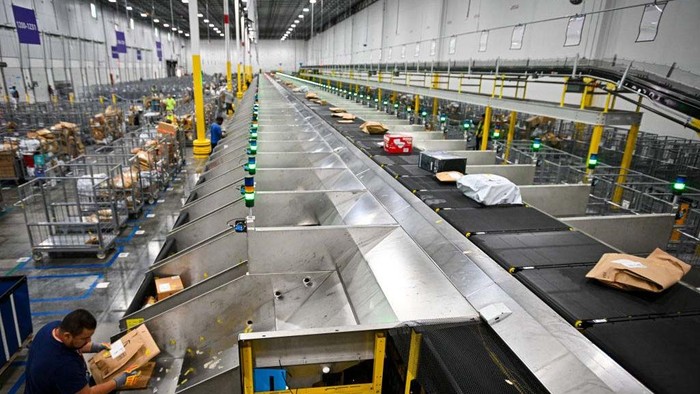 ORLANDO, FLORIDA  DECEMBER 2: An Amazon employee works to fulfill same-day orders during Cyber Monday, one of the companys busiest days at an Amazon fulfillment center on December 2, 2024 in Orlando, Florida. The fulfillment center, one of Amazons largest for same-day deliveries, saw more than 200 workers sorting, packing, and shipping items throughout Central Florida. This location processes more than 20,000 packages on any given day, but during the holiday season, that number jumps to more than 80,000. (Photo by Miguel J. Rodriguez Carrillo/Getty Images)
