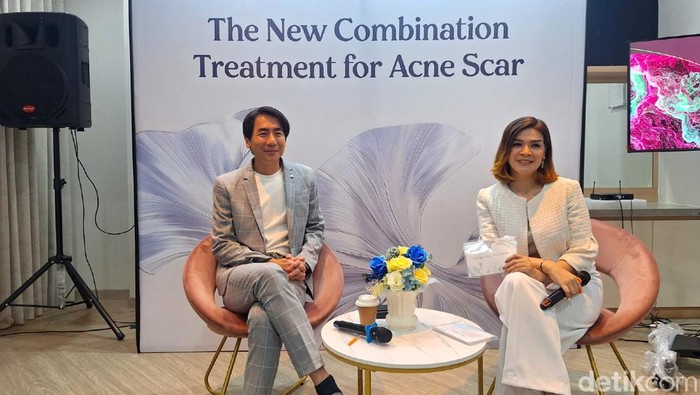 Close up of problematic skin with deep acne scars on cheek