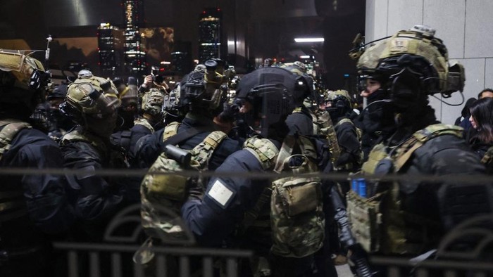 Police struggle with people trying to enter the National Assembly in front of the main gate of the National Assembly in Seoul, South Korea on December 3, 2024, after South Koreas President Yoon Suk Yeol declared emergency martial law. South Koreas President Yoon Suk Yeol on December 3 declared emergency martial law, saying the step was necessary to protect the country from 