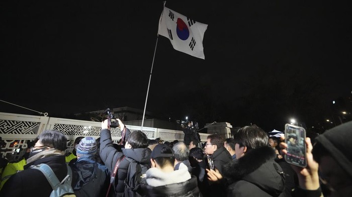 People try to enter the National Assembly in Seoul, South Korea, Tuesday, Dec. 3, 2024. (AP Photo/Lee Jin-man)