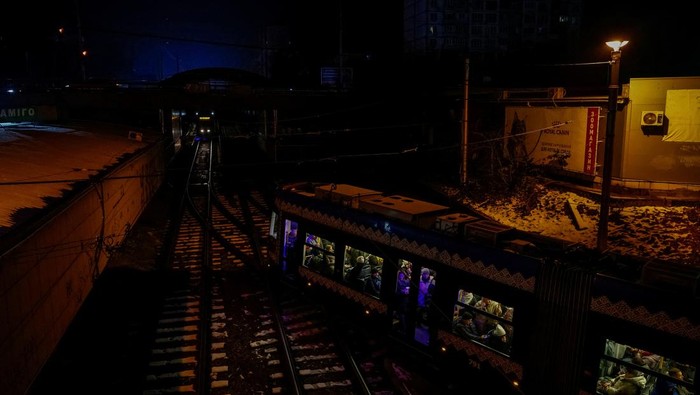 People travel in a tram during partial power-cuts, amid Russia's attack on Ukraine, in Kyiv, Ukraine, November 28, 2024. REUTERS/Alina Smutko     TPX IMAGES OF THE DAY