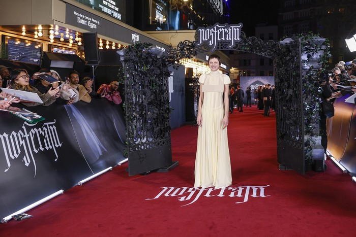 EDS NOTE: NUDITY - Emma Corrin poses for photographers upon arrival at the premiere of the film Nosferatu on Wednesday, Dec. 4, 2024, in London. (Photo by Millie Turner/Invision/AP)